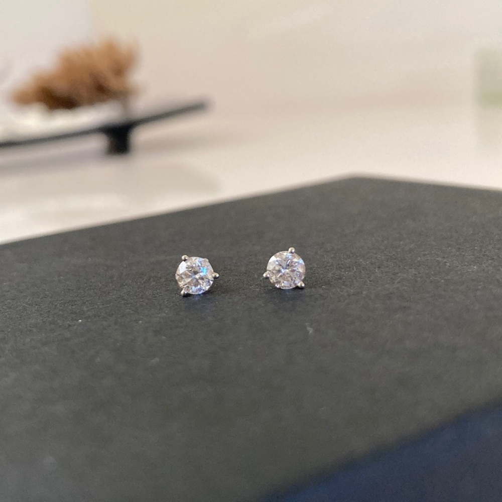 Diamond solitaire stud earrings in white gold setting